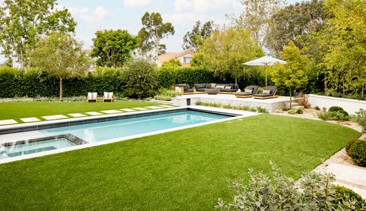 synthetic turf installation project with pool